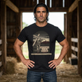 Black | Don't Go Quietly men's heavyweight tee — worn, front view, arched cross graphic